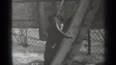 New York (1947): Small Child In Black Coat Hat Gloves Climbing Slide Near A Fence