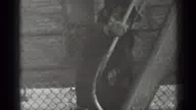 New York (1947): Black And White Footage Of A Little Boy Climbing Up The Ladders