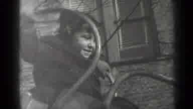 New York (1947): Child Playing On A Slide In Playground And Enjoying It With A Big