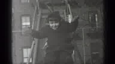 New York (1947): Child Goes Down The Slide While Smiling At The Camera