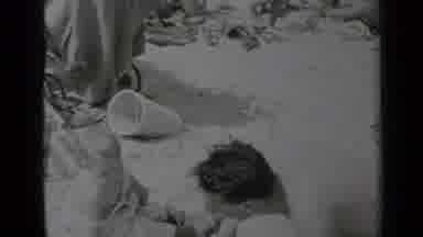 New York (1947): Man And Child Build A Sand Castle On A Beach Near The Water