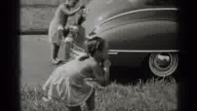 New York (1947): Kids Playing Game On Sidewalk Near Grey Car On A Sunny Day