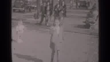 New York (1947): Little Girl Puts Something In Her Mouth As She Skates Up The Walk