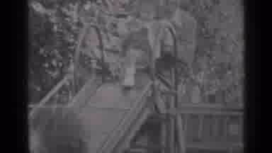 New York (1947): Mom Holding Child And Placing Her Down On Slide