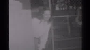 New York (1947): A Woman With Brown Curls In A White Blouse Peeks From Around A