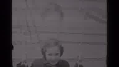 New York (1947): Some Children Riding On The Swing Sets In A Park