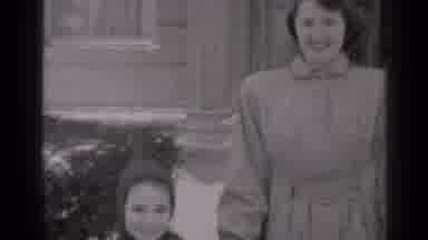 New York (1947): Smiling Woman And Child Leave Building Followed By Man With Huge