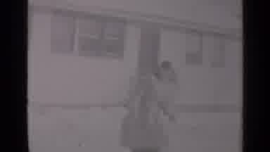 New York (1947): A Women Wearing A Coat And A Headscarf Runs And Plays In A