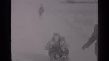 New York (1947): Mother And Son Sled Down Hill And Wave To Dad Behind The Camera