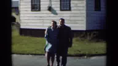 New York (1947): Young Couple Walking Away From A White House On A Bright Sunny