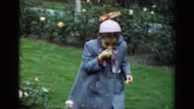 New York (1947): Girl Wearing Blue Coat Picks Up Object From Ground Next To Pink