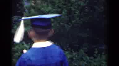 Indiana USA (1948): Grandparents See Young Boy Graduate Preschool In His Blue Gown