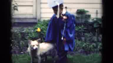 Indiana USA (1948): Preschool Graduate In Cap And Gown With Diploma Pets White Dog