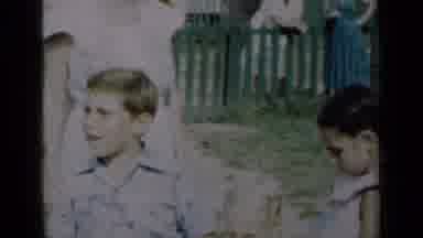 New York (1950): Little Boy Outside In The Grass Playing And Carrying A Colorful