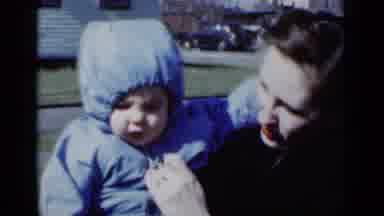 New York (1950): Lady Holding The Little Baby Playing With His Lip And Daddy