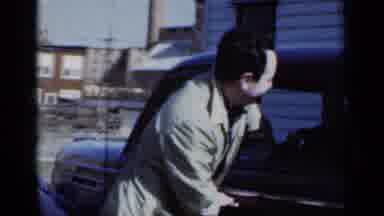 New York (1950): Man Opening Car Door For A Small Girl Located Beside A House