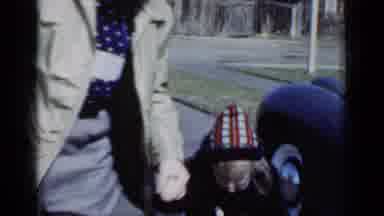New York (1950): A Man Holds A Girls Hand As They Walk Past A New Car