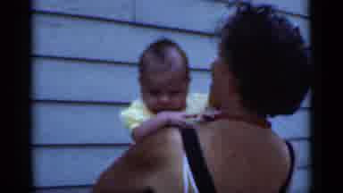 New York (1950): The Woman Is Having Fun Taking Care Of Her Child