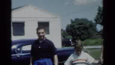 New York (1950): A Man A Young Man And A Boy All Holding Hands And Walking Outside