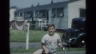 New York (1950): Young Boy On His Bicycle In The Driveway Of His Home With His