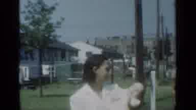 New York (1950): Woman With A Small Baby In Front Of Man With Swim Trunks On