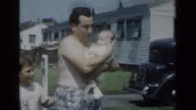 New York (1950): Fat Daddy Holds Infant As Young Son Talks Then Dad Turns Away