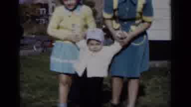 New York (1950): Mom And Sister Help Happy Baby Walk To Loving Father