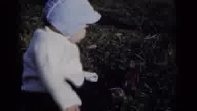 New York (1950): A Young Child No Older Than 2 Sitting On Grassy Ground Then
