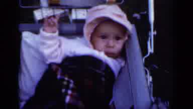 New York (1950): New Baby Girl Held Up By Mother After Car Ride