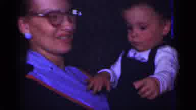 New York (1950): Young Girl Looks Displeased While Mother Smiles And Holds Infant