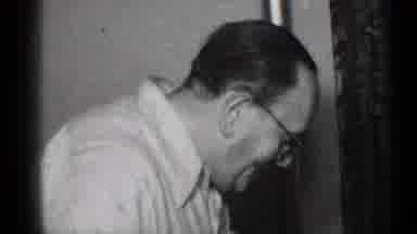 New York (1950): Baby Laying Down With Blanket Wakes Up Confused While Man Talks