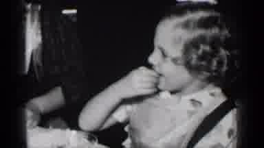 New York (1950): Little Girl Eating While Somebody Pushes Her Hair Out Of Her Face