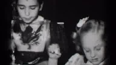 New York (1950): Children Feeding In Family On Holiday With Many Family Members At
