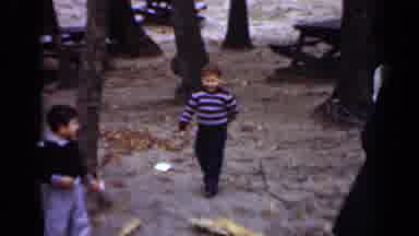New York (1950): Child In Striped Shirt And Brown Cap Walks Forward And Moves Hand