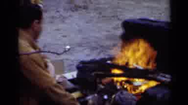New York (1950): People Toasting Marshmallows Over Open Campfire On A Clear Day