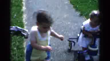 New York (1951): Little Girl In An Old Fashioned Walker Outside With Her Brother