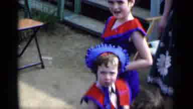 New York (1951): Pretty Little Girls In Red And Blue Dresses Watch As Another Girl