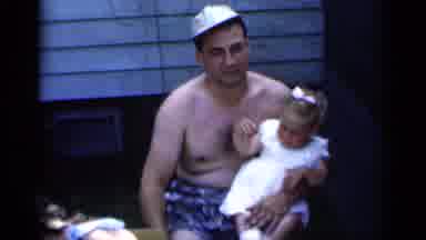 New York (1951): A Man Outside Holding A Baby Girl On Lap S A Lady And Children