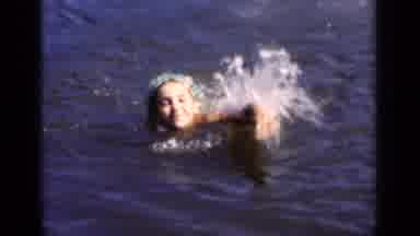 New York (1951): Woman Wearing Green Swim Cap Swimming In Lake On A Bright Sunny