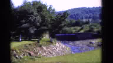 New York (1951): Landscape With Green Grass Trees Small River And Hills In The
