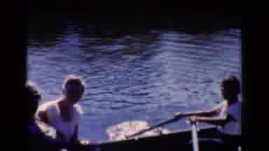 New York (1951): People Rowing A Small Boat Down The Ocean