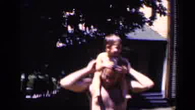 New York (1951): A Child Is Being Taken Of Their Fathers Shoulders To Walk Around