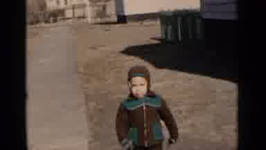 New York (1951): Little Fellow Does His Best To Walk In High Grass And Carry