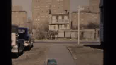New York (1951): 2oman Wearing Grey Hat Walks With Children Pushing Baby Carriage