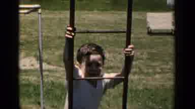New York (1951): Young Boy Playing On A Playground On A Summer's Day