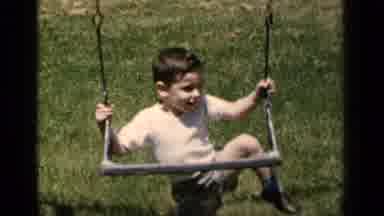 New York (1951): Young Boy Trying To Climb Onto A Swing That Is Set Too High For