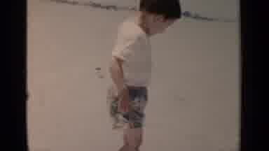 New York (1951): Young Boy At The Beach Playing In The Water With His Feet Running