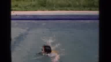 New York (1951): Child Swims In The Pool Towards The Camera And Smiles
