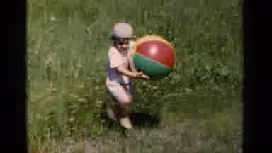 New York (1951): Little Fellow Does His Best To Walk In High Grass And Carry