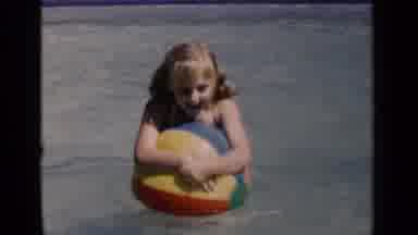 New York (1951): Blonde Haired Girl In Swimming Pool Tries To Balance On Beach